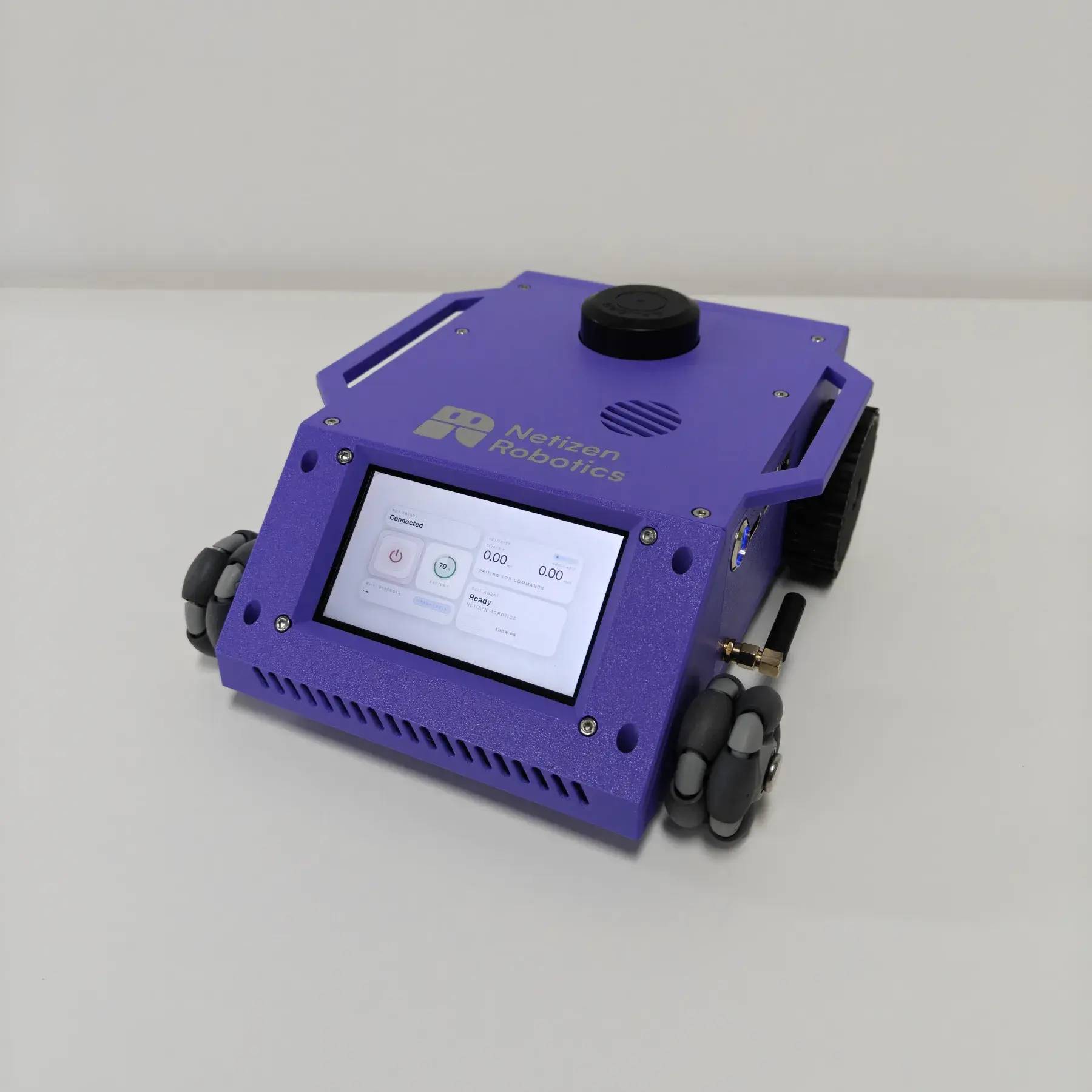 Completed Auron robot with purple chassis, touchscreen, lidar, and mecanum wheels.