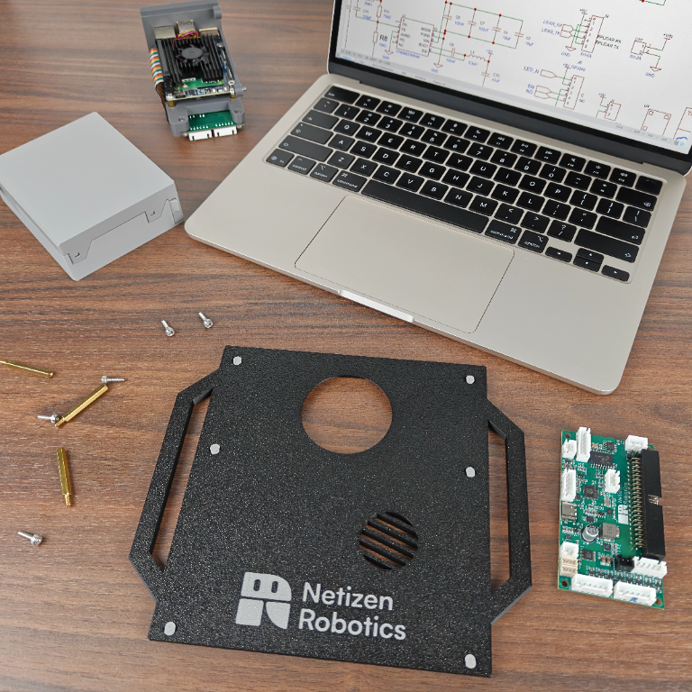 Workbench with Netizen Robotics components and circuit boards